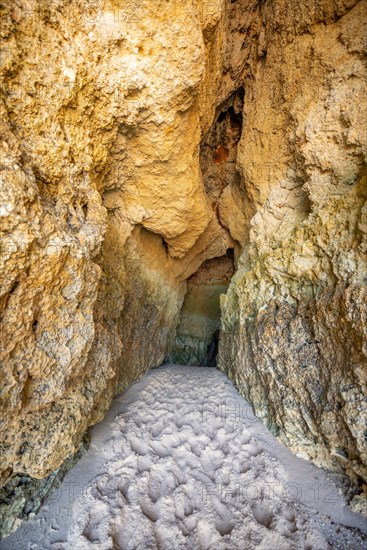 Rock cave washed out by the sea on the beach