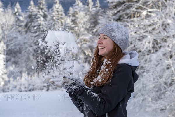 Woman enjoying the snow during winter walk