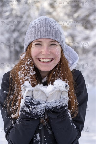 Woman enjoying the snow during winter walk