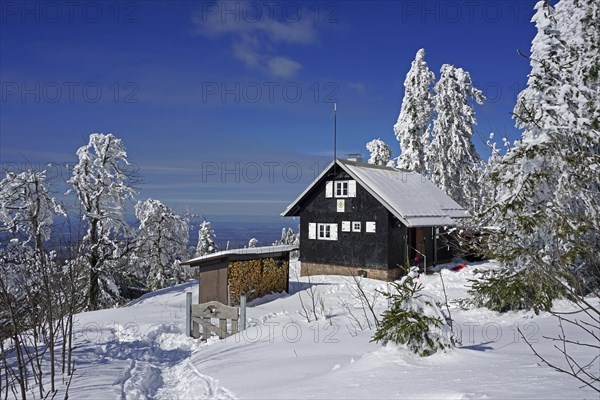 Mountain rescue hut and snowy landscape