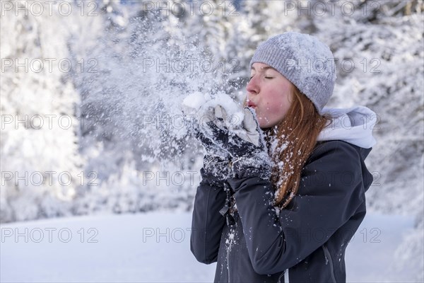 Woman enjoying the snow during winter walk