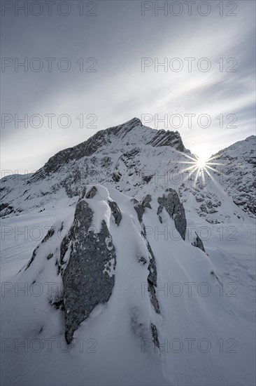 Snowy Alpspitze with sun star