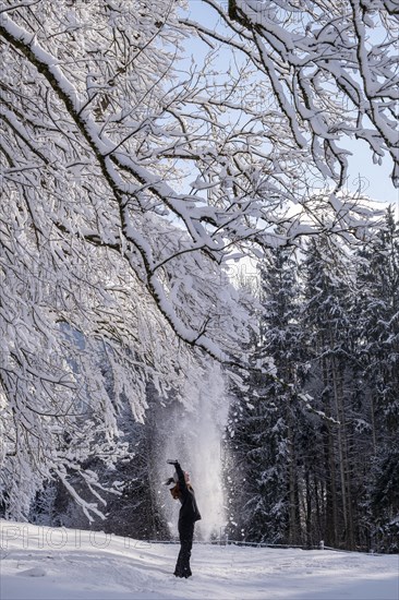 Woman enjoying the snow during winter walk