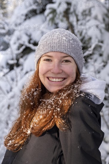 Woman enjoying the snow during winter walk