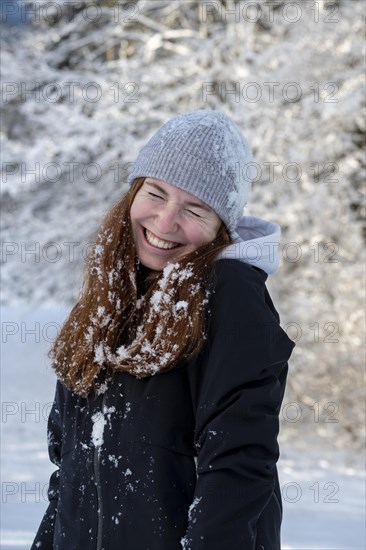 Woman enjoying the snow during winter walk