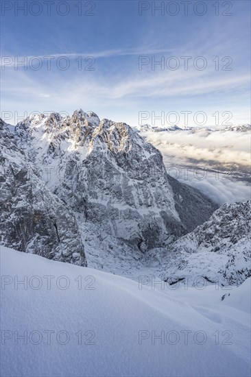 View of snowy Waxenstein and cloudy valley