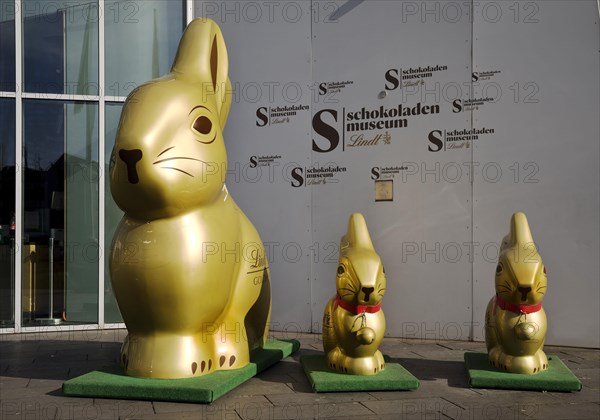 Golden Easter Bunnies in front of the Chocolate Museum