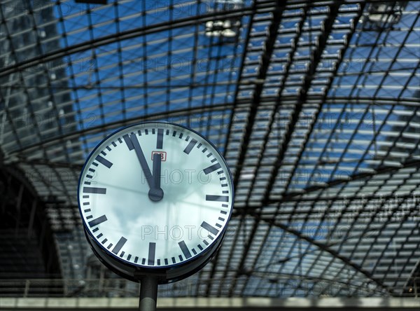 The station clock shows five to twelve