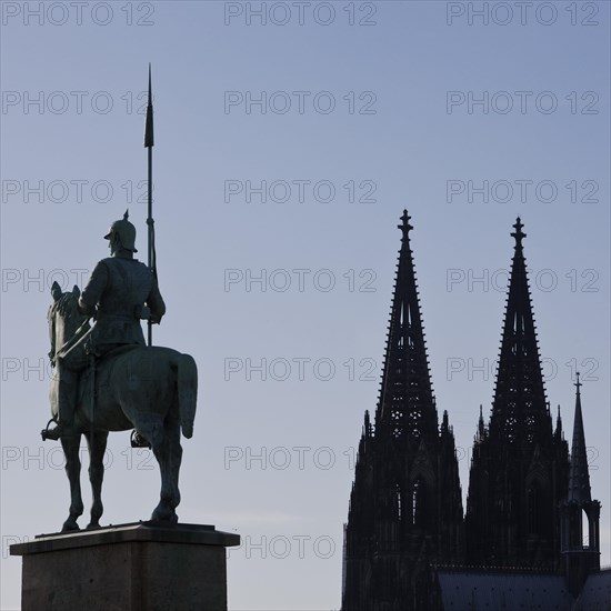 Monument of the 8th Prussian Cuirassier Regiment with the silhouette of the cathedral