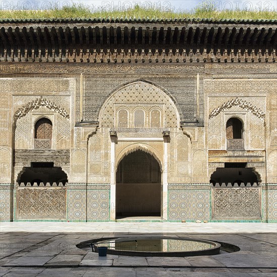 Wooden facade with ornaments and mosaics