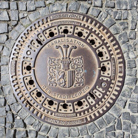 Manhole cover with coat of arms of the city of Leipzig