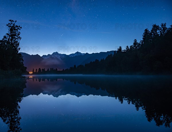 View of Mount Cook and Mount Tasman with starry sky