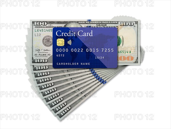 Mockup blue credit card resting on one hundred dollar bills on white background