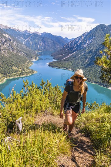 Hiker walking at Plansee