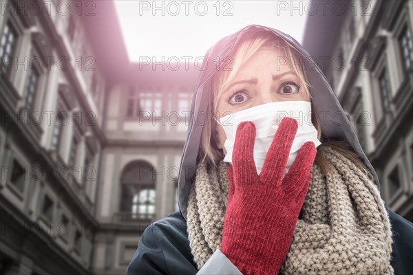 Young Woman Wearing Face Mask Walks Near the Uffizi Gallery