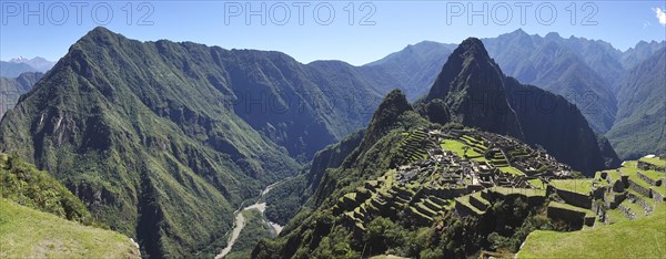 Inca ruined city with Mount Huayna Picchu