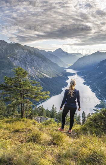 Hiker looking at Plansee