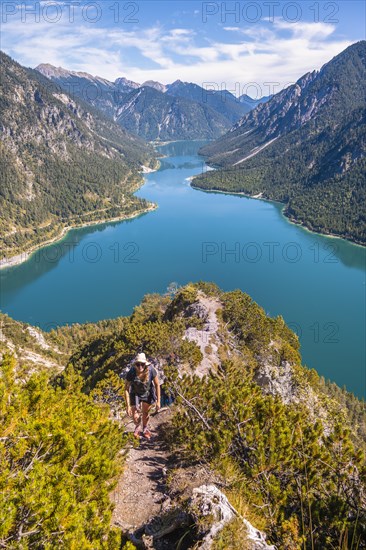 Hiker walking at Plansee