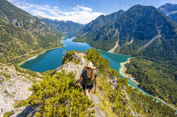 Hiker walking at Plansee