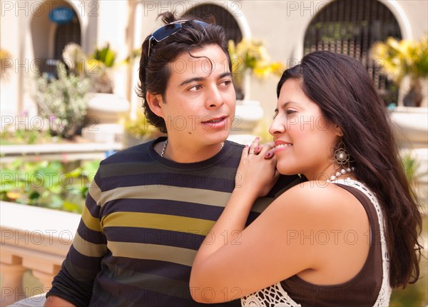 Attractive hispanic couple enjoying themselves at the park