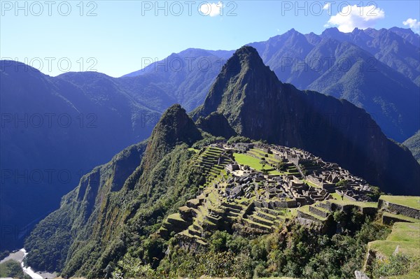 Inca ruined city with Mount Huayna Picchu