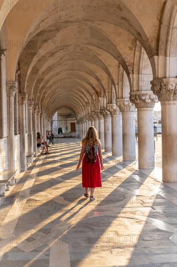 Young woman in the portico at the Doge's Palace