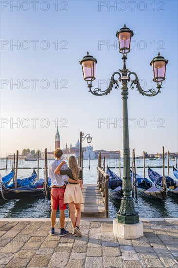 Young couple in front of a jetty