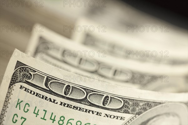 An abstract of one hundred dollar bills with narrow depth of field