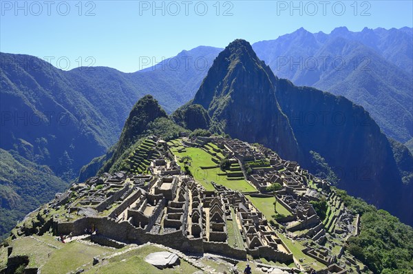 Inca ruined city with Mount Huayna Picchu