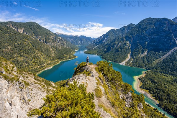 Hiker looking at Plansee