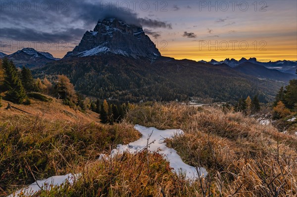 Peak of Monte Pelmo at sunrise with autumn landscape