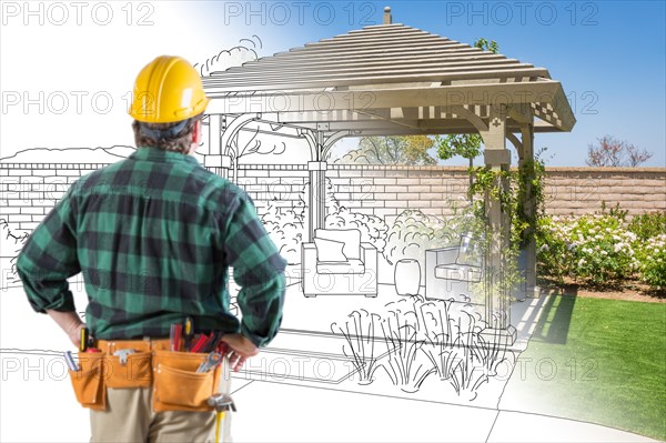 Contractor standing looking at patio pergola design drawing and photo combination