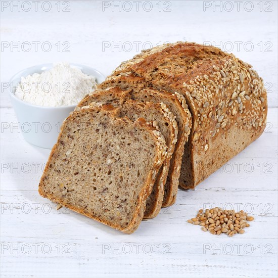 Bread multigrain bread wholemeal bread grain bread cut slice square on wooden board