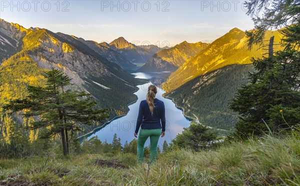 Hiker looking at Plansee