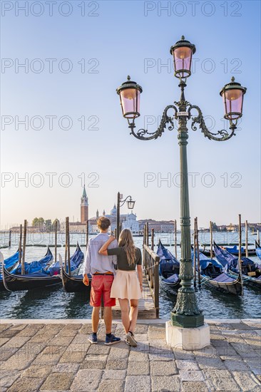 Young couple in front of a jetty