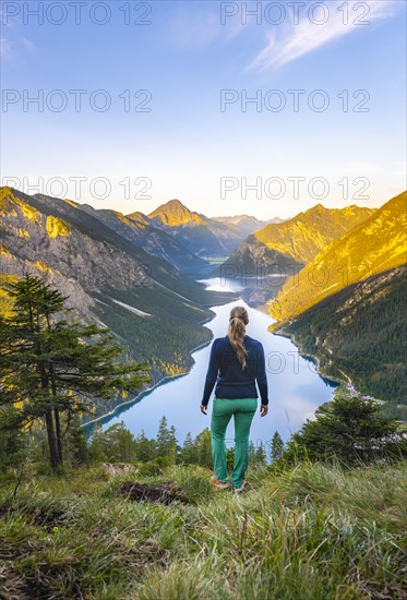 Hiker looking at Plansee