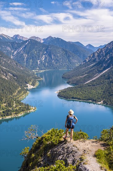 Hiker looking at Plansee