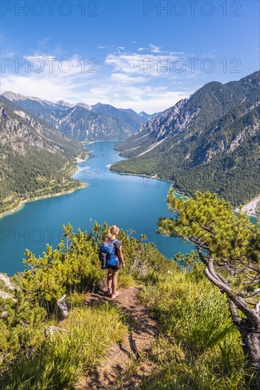 Hiker looking at Plansee