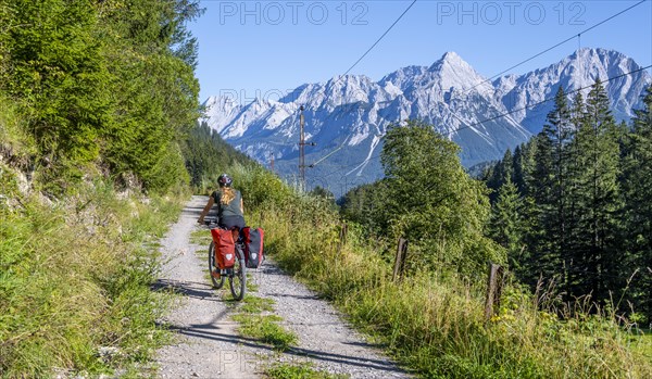 Cyclist on bike tour with mountain bike