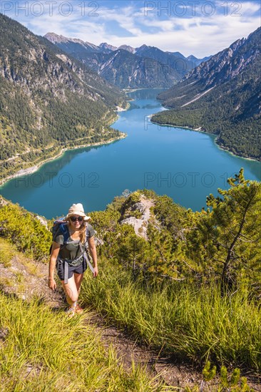 Hiker walking at Plansee