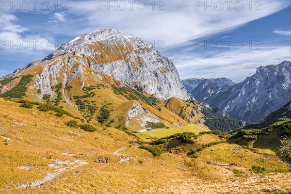 Hiker on a hiking trail in autumn