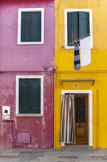 Door and window of a yellow and pink house