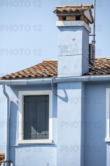 Blue house with chimney