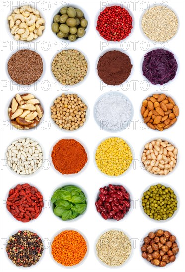 Herbs and spices vegetables nuts from above cutout on a white background