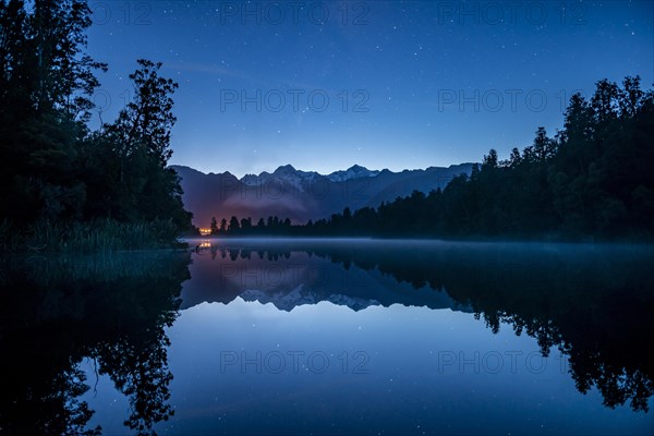 View of Mount Cook and Mount Tasman with starry sky