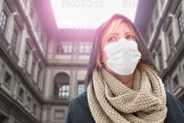 Young Woman Wearing Face Mask Walks Near the Uffizi Gallery