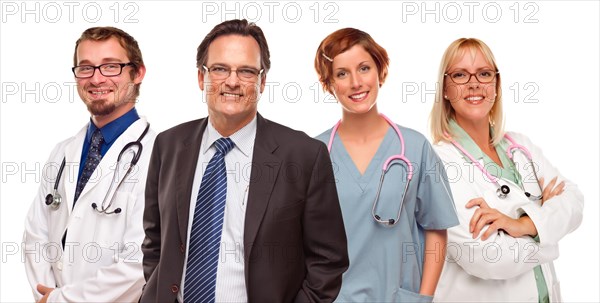 Smiling businessman with male and female doctors or nurses isolated on a white background