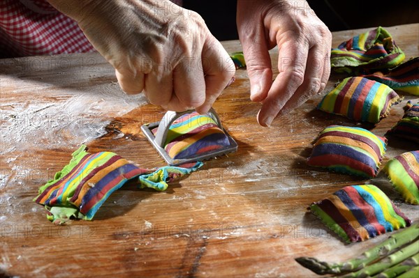 Fresh ravioli with ravioli cutter