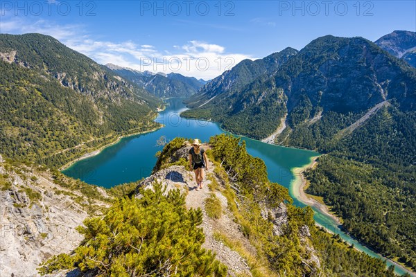 Hiker walking at Plansee