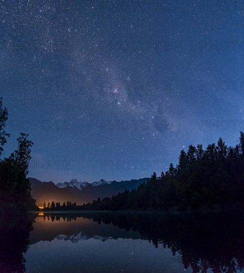 View of Mount Cook and Mount Tasman with starry sky and Milky Way